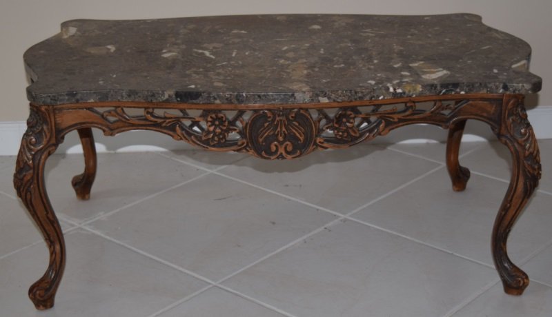 Louie XVI Country French Marble Top Coffee Table: Louie XIV country French marble top coffee table. Detailed scroll work. Shows repair on one corner. 39" x 22" x 17" 1920's