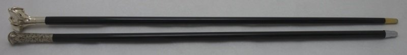 2 Sterling Handled Canes Bright Cut & Great Dane: 2 Sterling handled canes one is bright cut and the other is in the form of a Great Dane. One cane bears hallmarks. Both canes are ebonized wood with brass tips. 13/16" dia 36" & 37" long modern