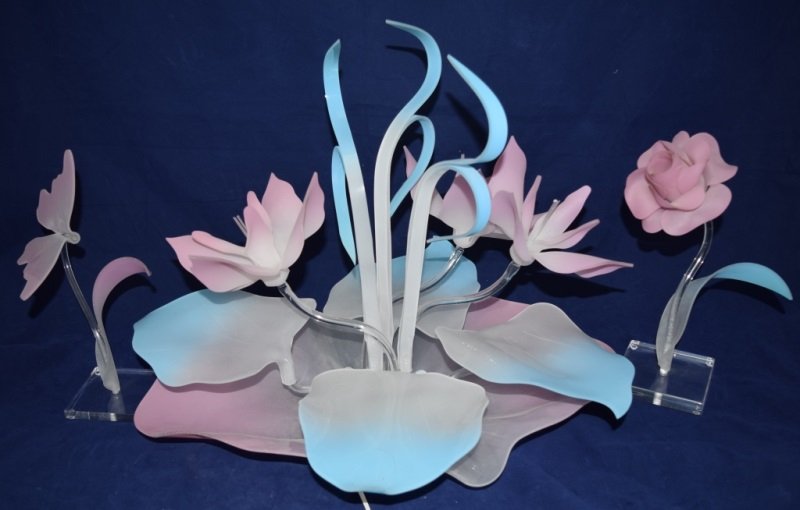 Lucite Floral Lighted Display Blue & Pink: Lucite floral light display with butterfly and flower garnishes. Blue and pink with lighting measures 23" x 18" x 18". see description 80s