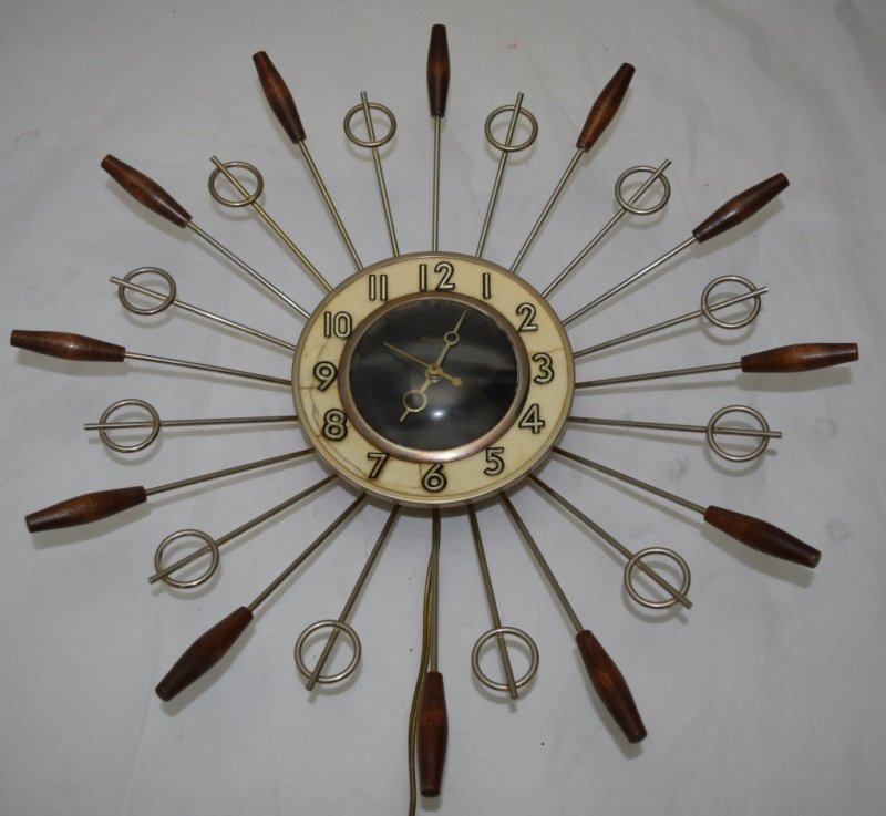 1960's Starburst Electric Clock United Model #79: 1960's Starburst Electric Clock model #79 by United in working condition. 18" dia x 3" 1960's
