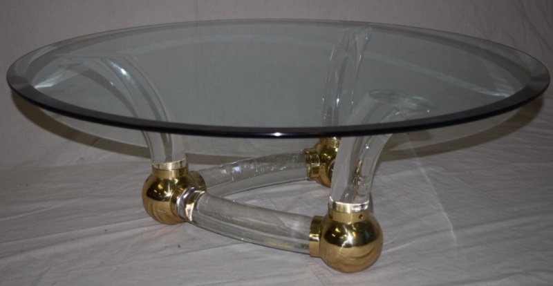 Italian Lucite & Brass Tusk Coffee Table: Italian Lucite and brass elephant tusk coffee table. 40" dia 16" tall 1980's