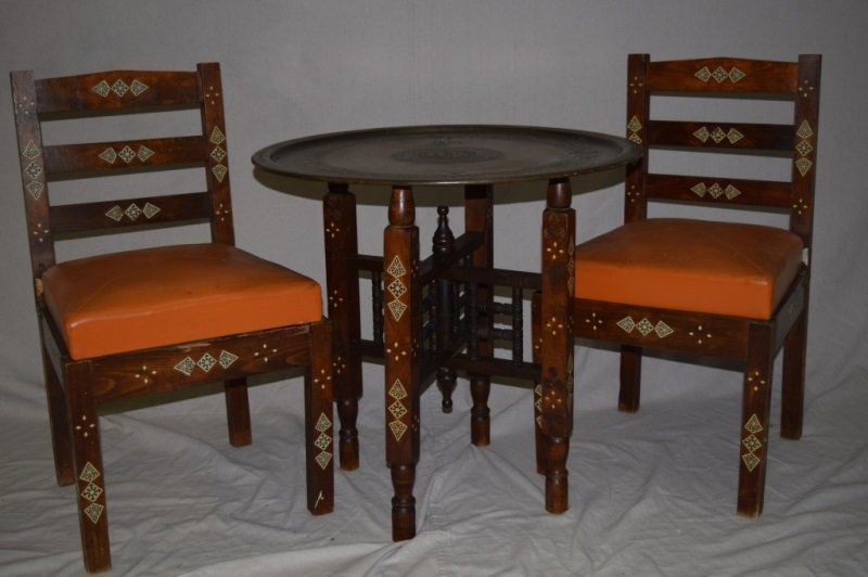 Persian Tea Table Set With Bronze Top Ivory Inlay: Antique Persian folding tea table set with bronze top and ivory inlays along the legs. Comes with two matching chairs. Some repaired insect damage on chairs. Chairs measure 19" x 19" x 3" 28.5" diamet