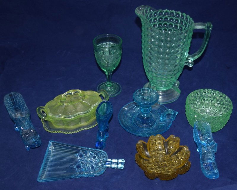 10pc Green, Blue Vaseline & Uranium Glass Objects: 10pc of various Vaseline & uranium glass. Pieces range from 4" tall x 3" wide to 10" tall x 5" in diameter. Included are 2 blue pressed vaseline glass boots. One blue pressed vaseline glass roller ska