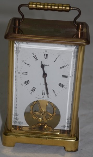 Bulova Windup Carriage Clock in Brass & Glass Case: Bulova windup carriage clock in a brass and glass case in working condition. 3.5" x 2.5" x 6" 1960's