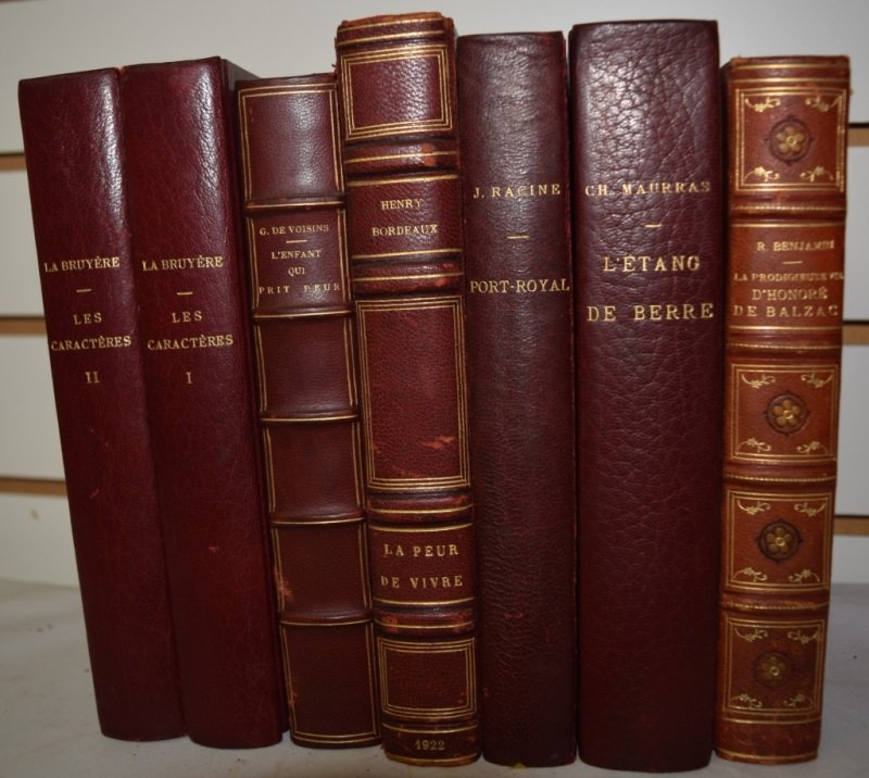 French Leather Bound books. Classic French Novels: Set of 7 red leather bound French classic novels. "La Prodigieuse vie D'Honoré de Balzac" © 1925. "L'Enfant Qui Prit Peur" Gilbert De Voisins © 1926 " La Peur de Vivre" Henry Bordeaux © 1922 "Abr�