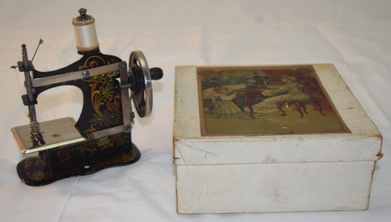 Vintage Mini Sewing Machine Made in Germany: Vintage hand painted mini sewing machine made in Germany. In working condition with original instructions and table clamp. No 118754 6.5" x 2.5" x 6"