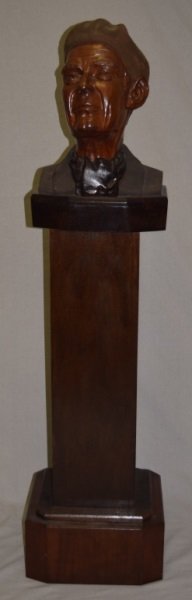 Full Bust General Montgomery by Philip Rosenblatt: Over sized bust of WWII General Montgomery mounted on a pedestal. The wood is textured, polished and carved from cherry wood by Philip Rosenblatt a previous Manhattan Project scientist turned artist. 