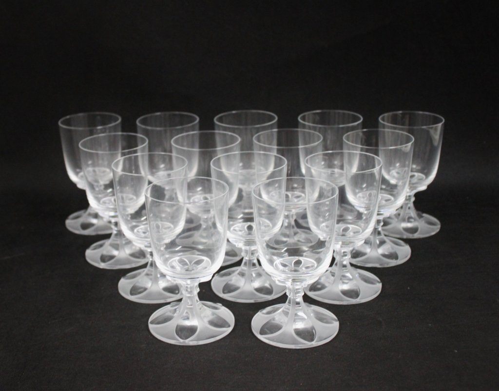 (14) Lalique Valencay Stemmed Wine Glasses: Set of (14) Lalique, France, "Valencay", art deco design clear stemmed wine glasses. Perfect condition, except for 2 small chips, as shown. Measures 3 d" x 5" (each)