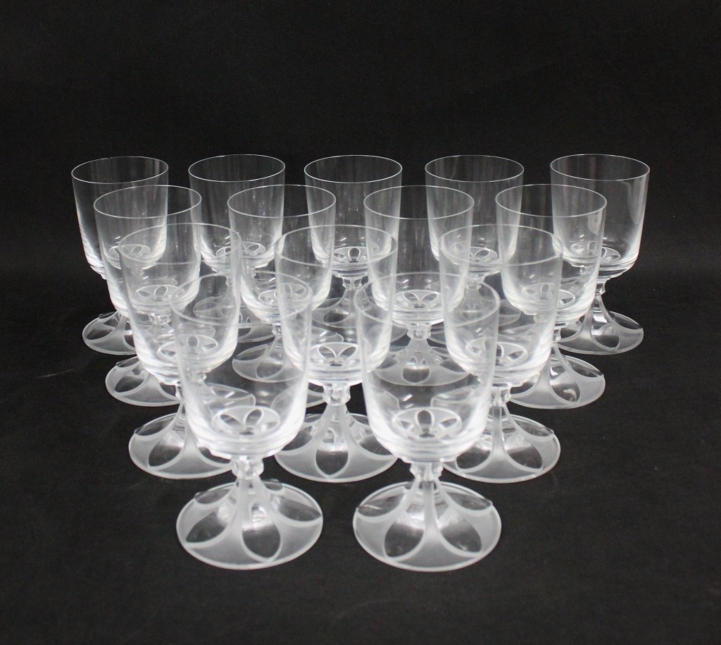 (14) Lalique Valencay Stemmed Water Glasses: Set of (14) Lalique, France, "Valencay", art deco design clear stemmed water glasses. Perfect condition, except for 2 small chips, as shown. Measures 3.5"d x 6" (each)