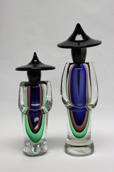 (2) Murano Glass Oriental Figures: (2) Murano Submersso glass sculptures in the form of oriental figures by Luigi Onesto. Signed on bottoms, with original Vetreria Artistica Obali label on the standing figure. Excellent condition. Tall