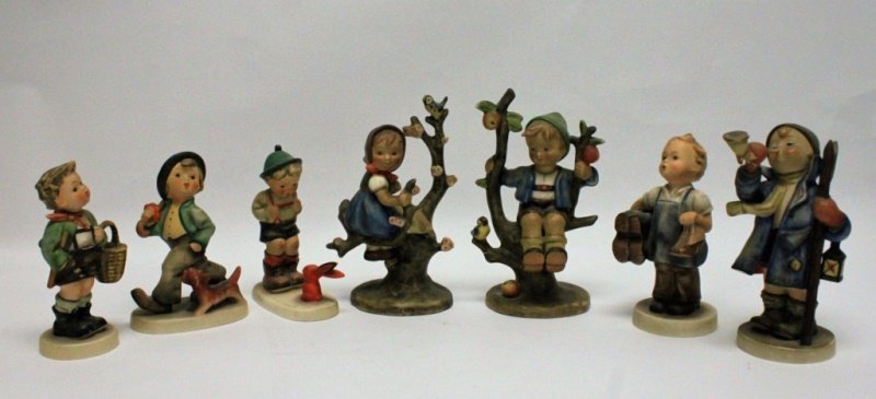 (7) Goebel Germany Hummel Figurines Tree Climbers: (7) Goebel W. Germany porcelain Hummel figurines. 6 in excellent condition. Boy sitting on branch shows repair. Measure 4.75" - 7"tall, each.