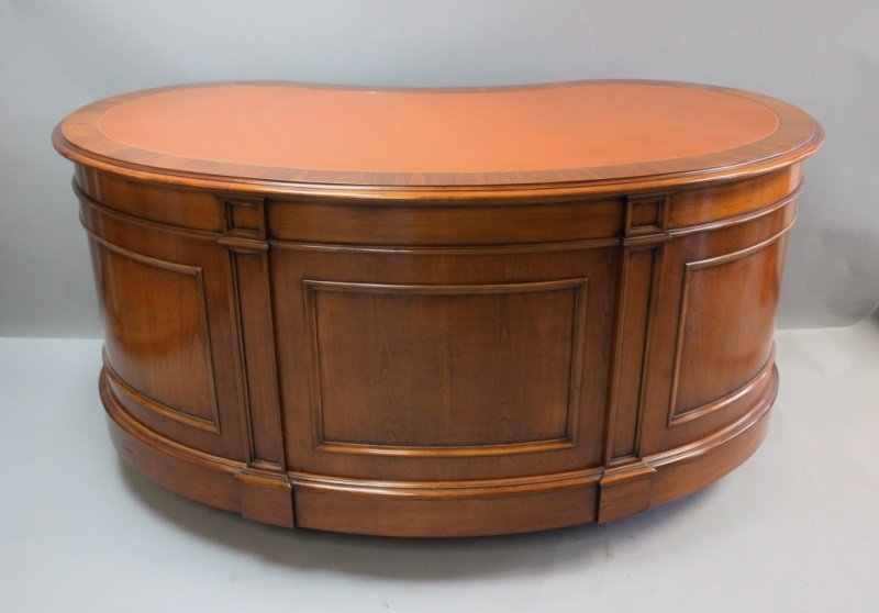 Mahogany Leather Top Kidney Shape Executive Desk: Mahogany and embossed leather topped, kidney- shaped knee hole executive desk with 5 drawers. Excellent condition. Measures 74" x 42" x 30".