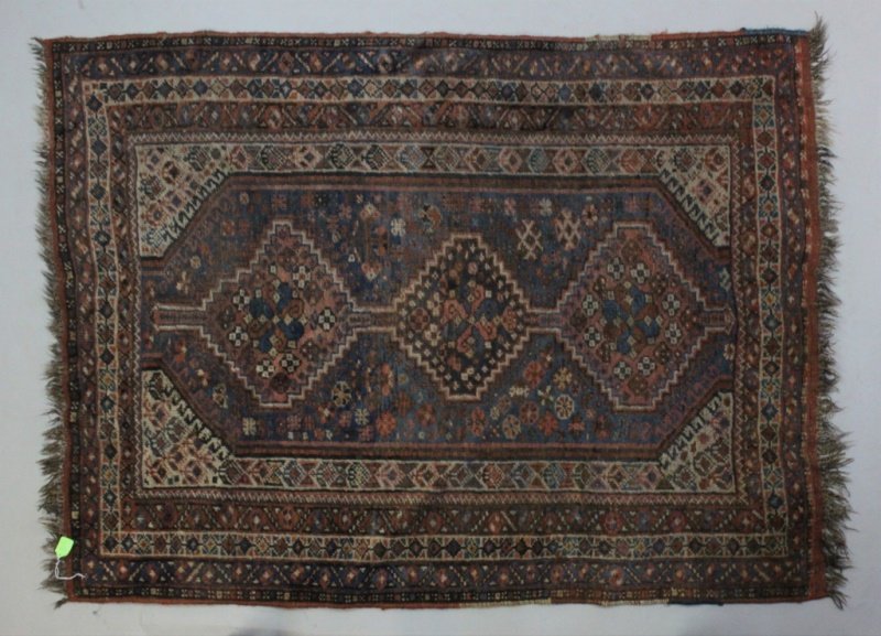 1940's Era Armenian Wool Area Rug: 1940's era Armenian wool area rug with a geometrical and floral motif. Has a hanging attachment sewn lengthwise and a label numbered 5149. Excellent condition. Measures 48" x 64.