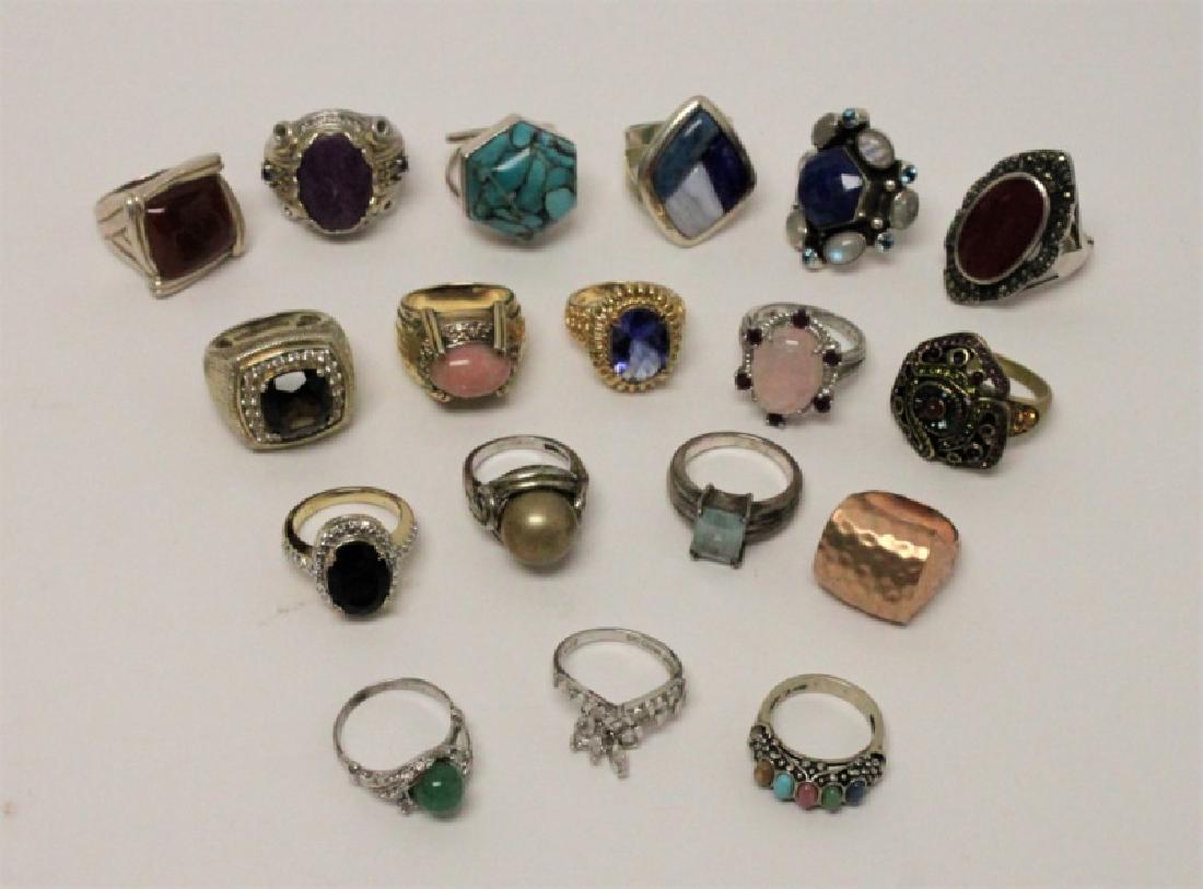 (18) Sterling Silver & Gemstone Cocktail Rings: (18) Assorted Sterling Silver cocktail statement rings, some inlayed with semi-precious stones such as Turquoise, Lapis Lazuli, Rose Quartz, and more. Very good to excellent condition. Total weight =