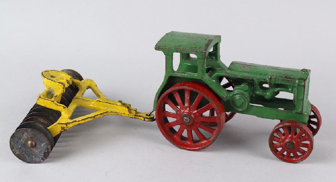 Cast Iron Tractor and Disc Attachment (1 of 2)