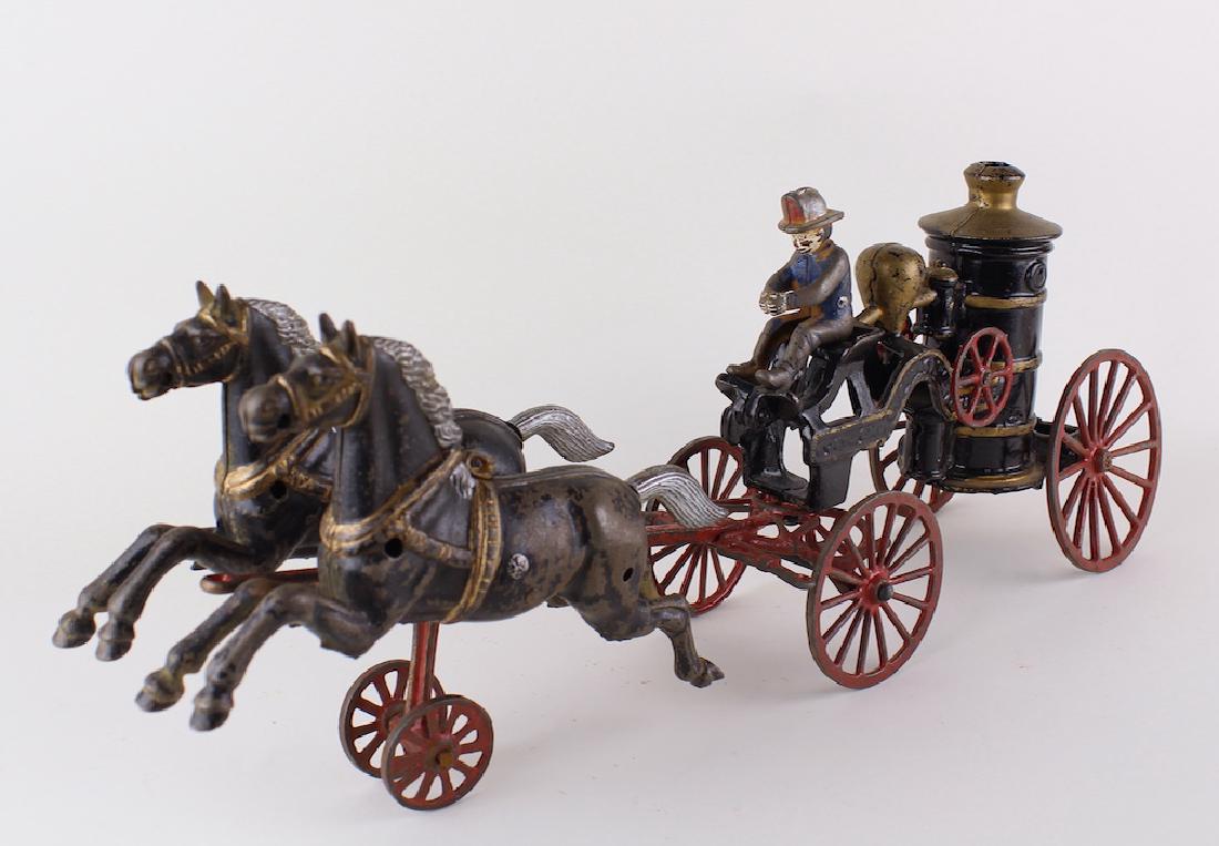 Cast Iron Horse Drawn Fire Pumper Ives/Carpenter 19": American Cast Iron Horse Drawn Fire Pumper Ives/Carpenter. 19 inches long. Great casting, note detail to horse's mane.