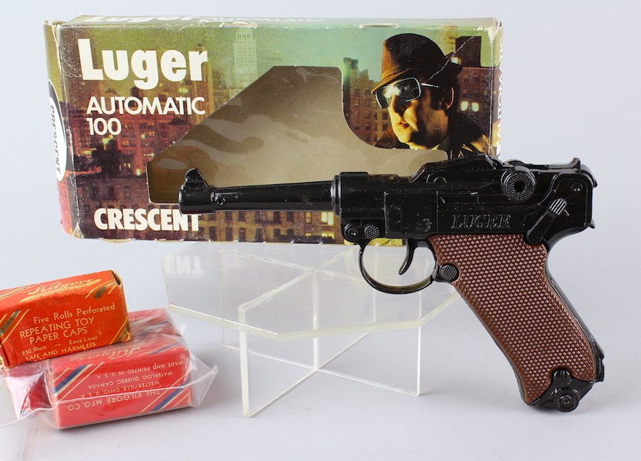 Crescent Automatic 100 Luger Cap Gun in the Box Spy!: Crescent Automatic 100 Luger Cap Gun in the Box with Spy graphics. Excellent with 2 rolls of caps.