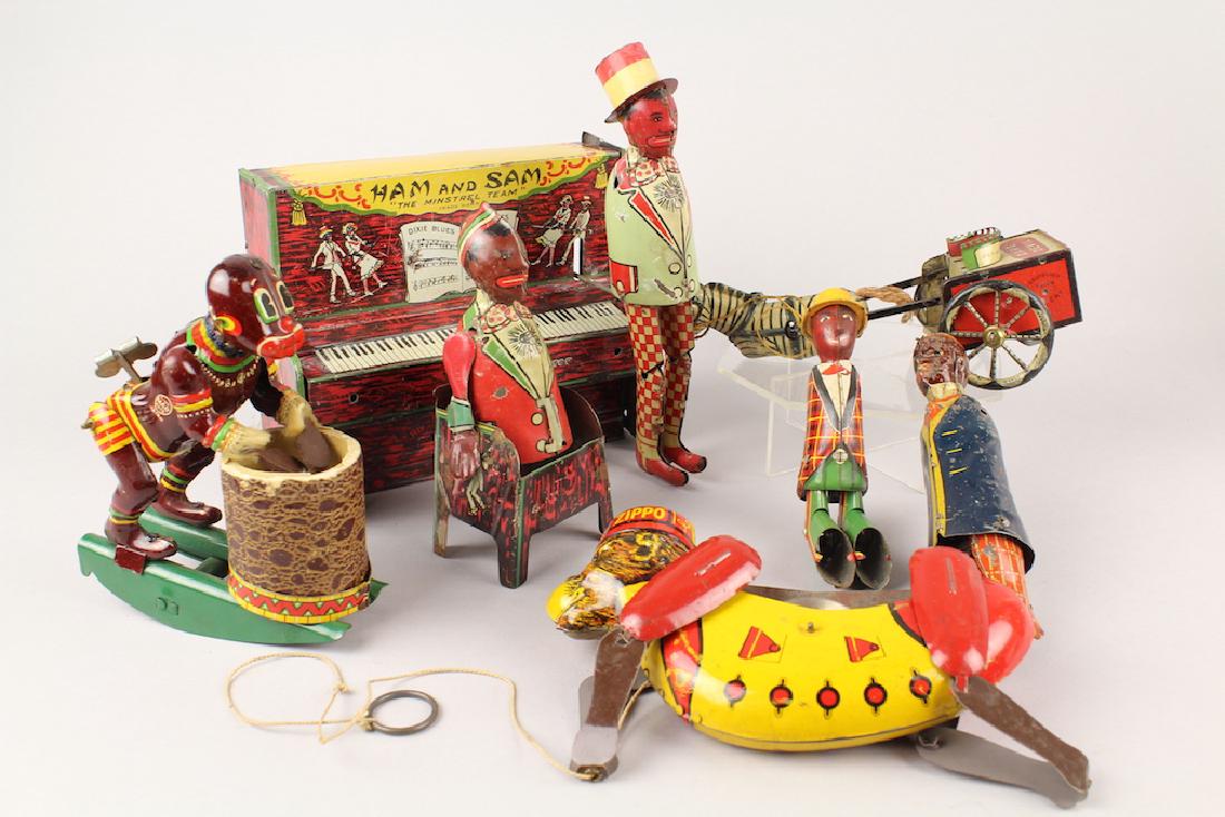 Strauss Ham & Sam & Lehmann Parts Lot: Parts lot of black tin toys. Ham & Sam by Strauss, TPS native drummer, tap dancing Sam, Lehmann Coon Jigger and Dare Devil. All parts some great parts like the Lehmann wheels! No works inside the pian