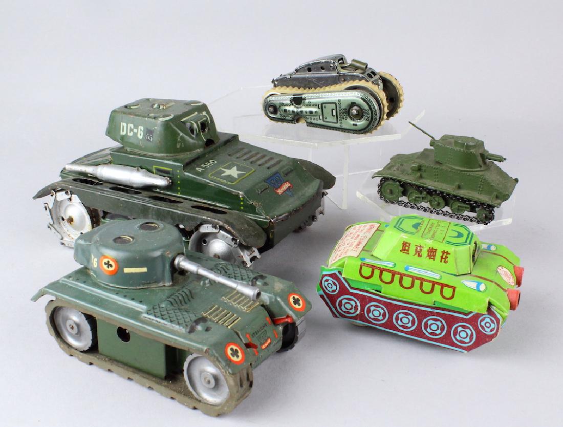 Arnold German and Other Tanks Lot: Arnold German and Other Tanks Lot including old fireworks paper tank and tin penny toy. One Arnold missing gun.
