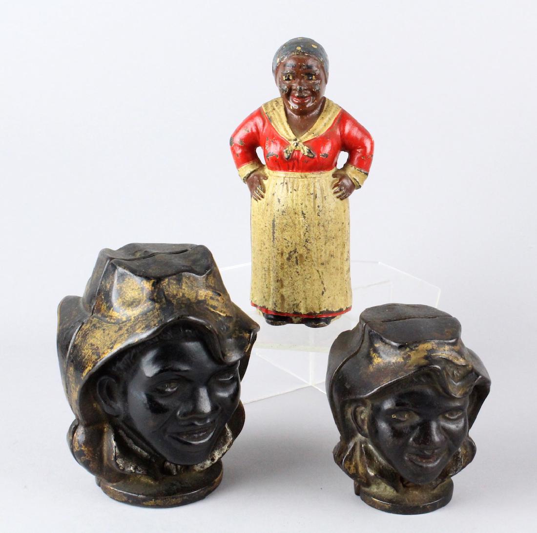 2 A C Williams Black 2 Face & Hubley Mammy Still Banks: 2 Williams Black 2 Face banks in 2 sizes & Hubley Mammy Bank. Tallest 5 inches.