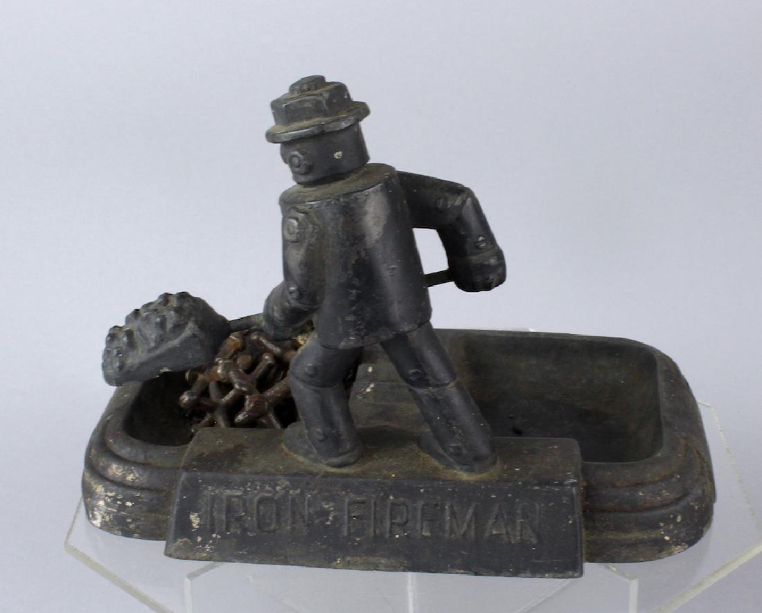 Robot Metal Advertising Tray Art Deco: Robot Metal Advertising Tray Art Deco. Iron Fireman robot shoveling coal advertising toy tray/ash tray made of metal.