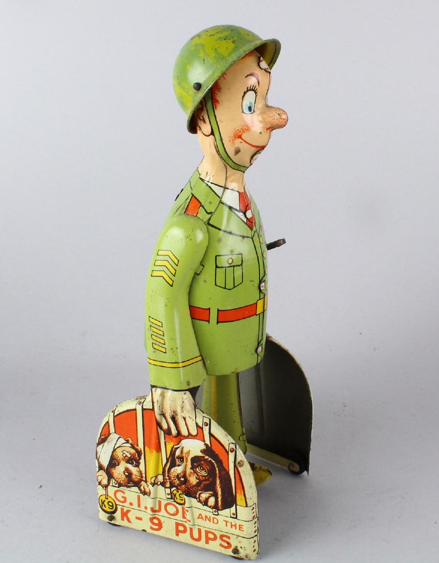 Unique Art GI Joe and the K-9 Pups Tin Toy: Unique Art GI Joe and the K-9 Pups Tin Toy wind up walking toy.