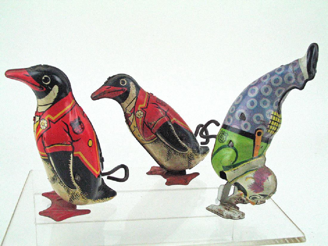 J. Chein Tin Toys: J. Chein Tin Toys, penguins and hand walking clown.