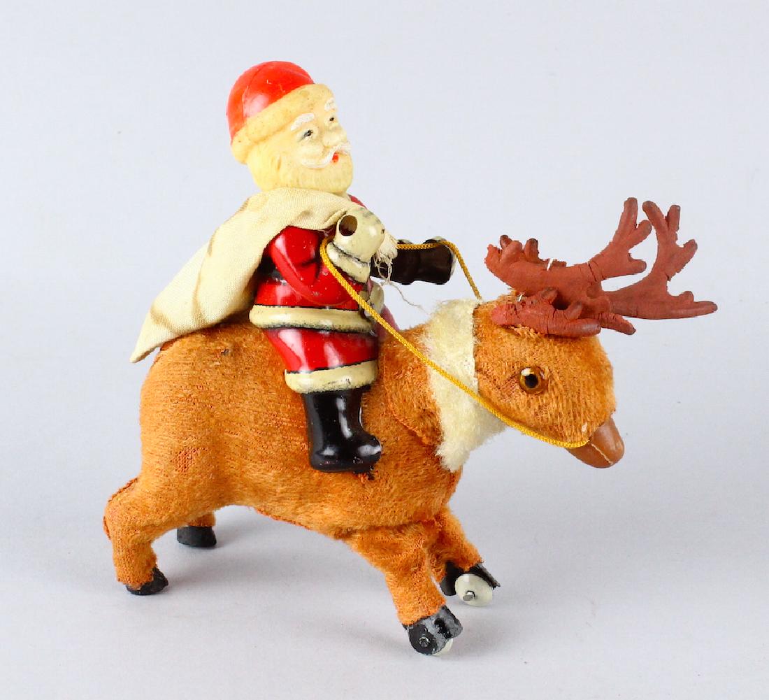 Santa on Reindeer Japan Celluloid & Tin Wind Up: Santa Claus on Reindeer Japan Celluloid & Tin Wind Up. Wind up works, reindeer antlers are very fragile and will need to be glued back on.