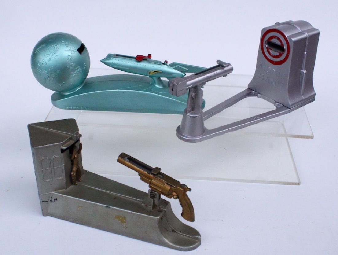 Atomic, Spaceship & Wild West Bank: 3 Mechanical shooting banks- Atomic, Spaceship and Duro Wild West Bank. All in excellent original working condition. Wild West has gun that shoots coins toward cowboy having trap underneath.