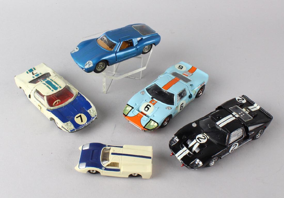 Corgi Race Car Diecast British: Corgi Race Car Diecast. Four diecast racers and one body shell, possibly a slot car.