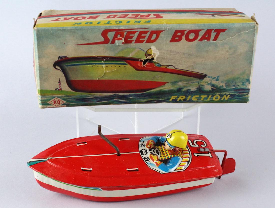 Japan Tin Speedboat in Box: Japan Tin Speedboat in Box. Working friction wind propeller with driver in the original box. Box with some tears as shown.