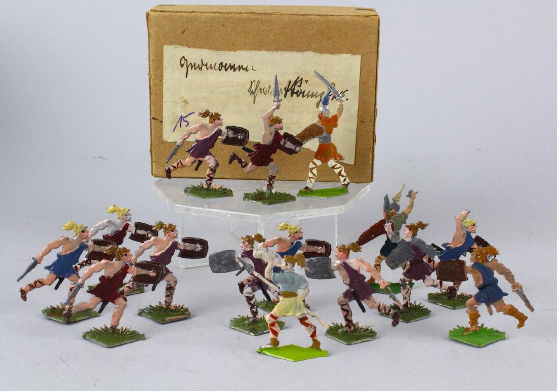 Roman Soldiers with Shields/Swords German Tin Flats: Roman Soldiers with Shields/Swords German Tin Flats. Note: from a collection of German Tin soldier flats from the 1860s to 1920s. Most were never fully removed from the boxes. The boxes contain the or