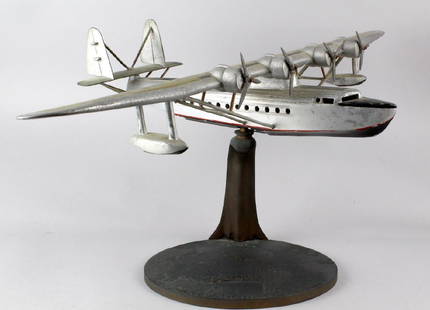 1930s Travel Agent Pan Am Airplane Flying Clipper Large: 1930s Travel Agent Pan American Airplane on the original bronze stand "Routes of the Flying Clipper Ships". Impressive heavy and well made all metal 4 prop airplane used to enitce exotic air travel to