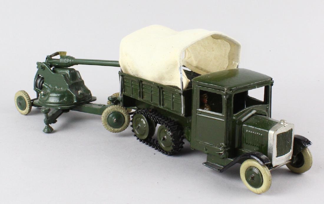 Britains Large Half Track Truck and Cannon: Britains Large Half Track Truck and Cannon with soldiers. Excellent shape, one small post holder for canvas top post is broken.