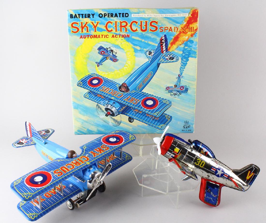 Japan Tin Navy Rocket Gun & Sky Circus Biplane In Box: TPS Japan Tin Spad Sky Circus Biplane airplane mint in the box and Navy airplane rocket toy sparking gun. (some loss to gun litho, but working).