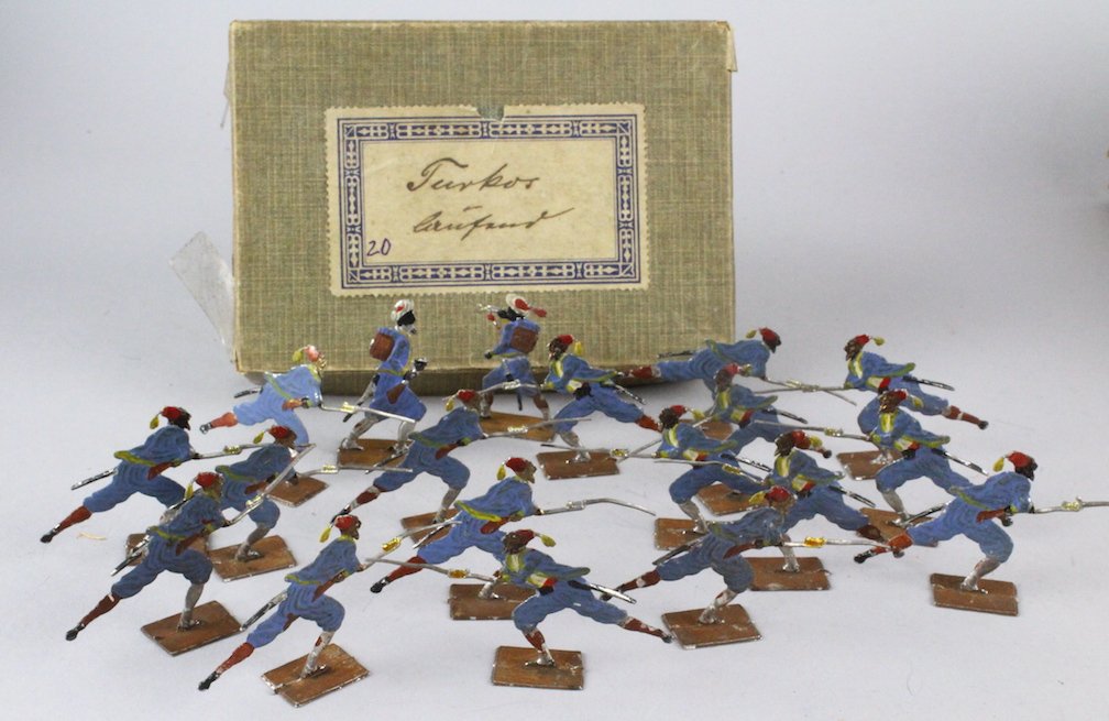 Early German Tin Flats Turkish Warriors: Early German Tin Flats Turkish Warriors. Note: from a collection of German Tin soldier flats from the 1860s to 1920s. Most were never fully removed from the boxes. The boxes contain the original wood 