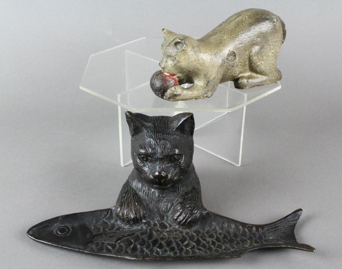 Cat with Fish Bronze & Cat with Ball Cast Iron Bank: 2 Antique cats, one original paint cat with ball bank and bronze cat eyeing up a fish pen tray. Both in excellent condition. Pen tray is 8 inches wide.