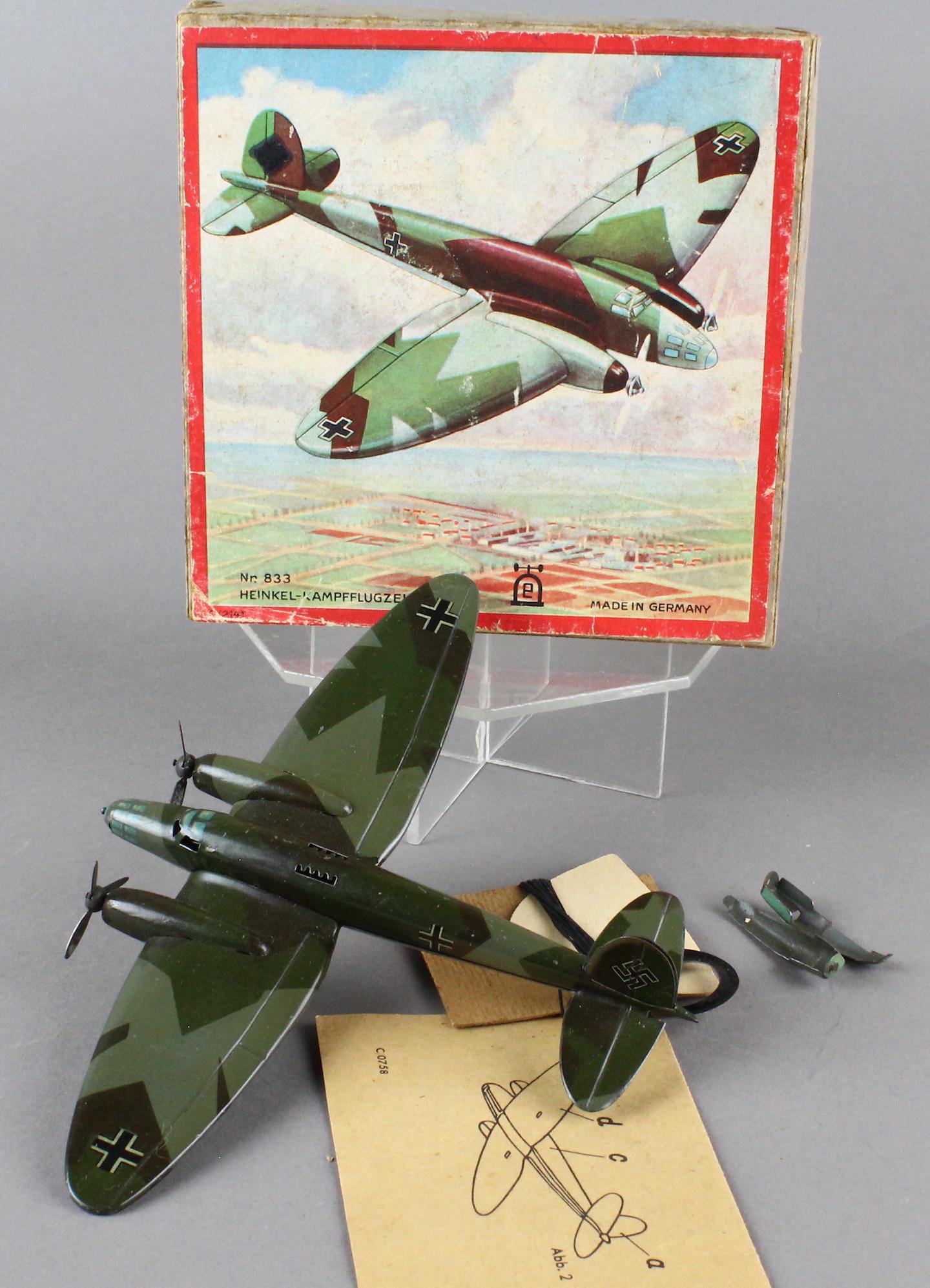 Lehmann German Tin Heinkel Airplane 833 In Box: Lehmann German Tin Heinkel Airplane 833 In Box. Pristine original tin toy with instructions and accessories in the original bright box.
