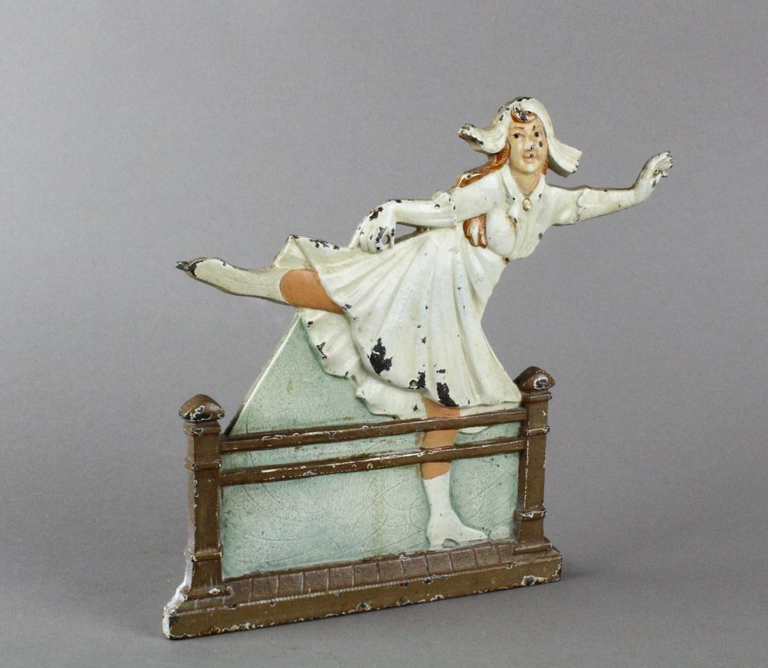 Sonja Heniee Ice Skater String Holder/Door Stop Rare: Sonja Henie Ice Skater String holder, missing string holder piece now a Door Stop! 1920s scarce cast iron in the original paint. Dutch style skater modeled from the superstar Sonja Henie.rnrnSonja Hen