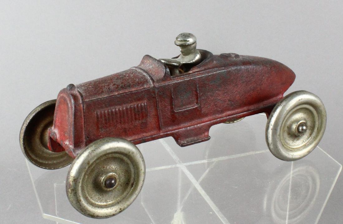 Kenton Cast Iron Boat Tail Racer: Kenton Cast Iron Boat Tail Race car with driver.
