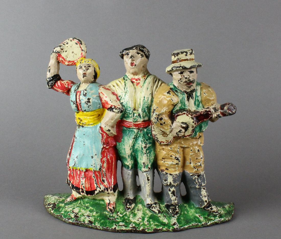 Hubley Street Singing Gypsies Doorstop: Hubley Street Singing Gypsies Doorstop 7 x 7.5 x 3 inches, original paint.