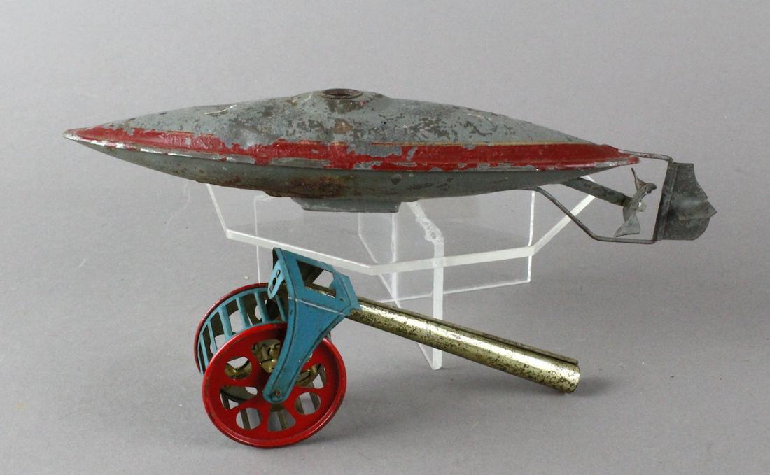 Bing German Submarine & Tin Penny Toy Squirrel in Cage: German Submarine & Germany Tin Penny Whistle- Toy Squirrel in Cage blow whistle. Sub not working, Squirrel goes around the turning cage (prob. made by Meier of Germany) in excellent shape.
