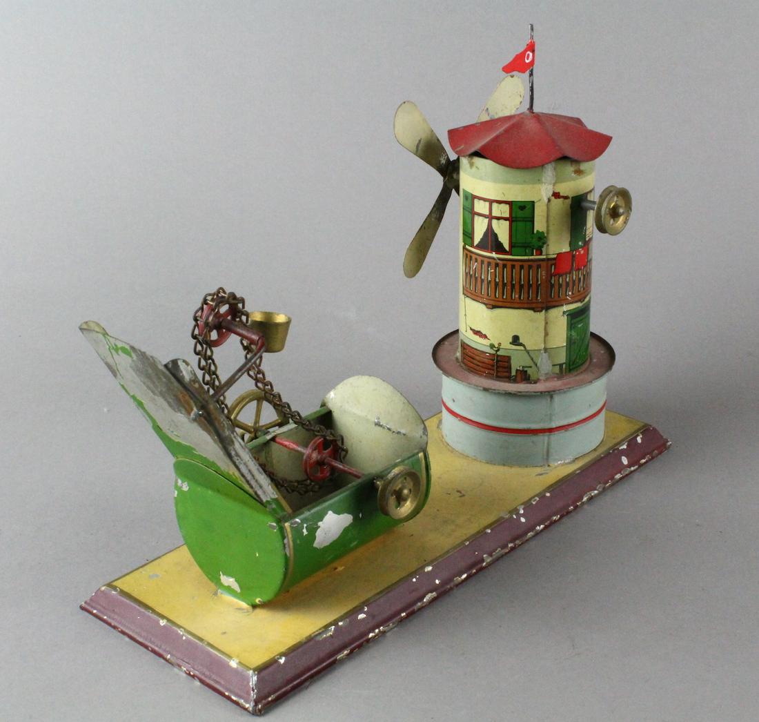 German Tin Windmill Water Dredge Bing: German Tin Windmill Water Dredge Bing. Clean working tin windmill steam toy.