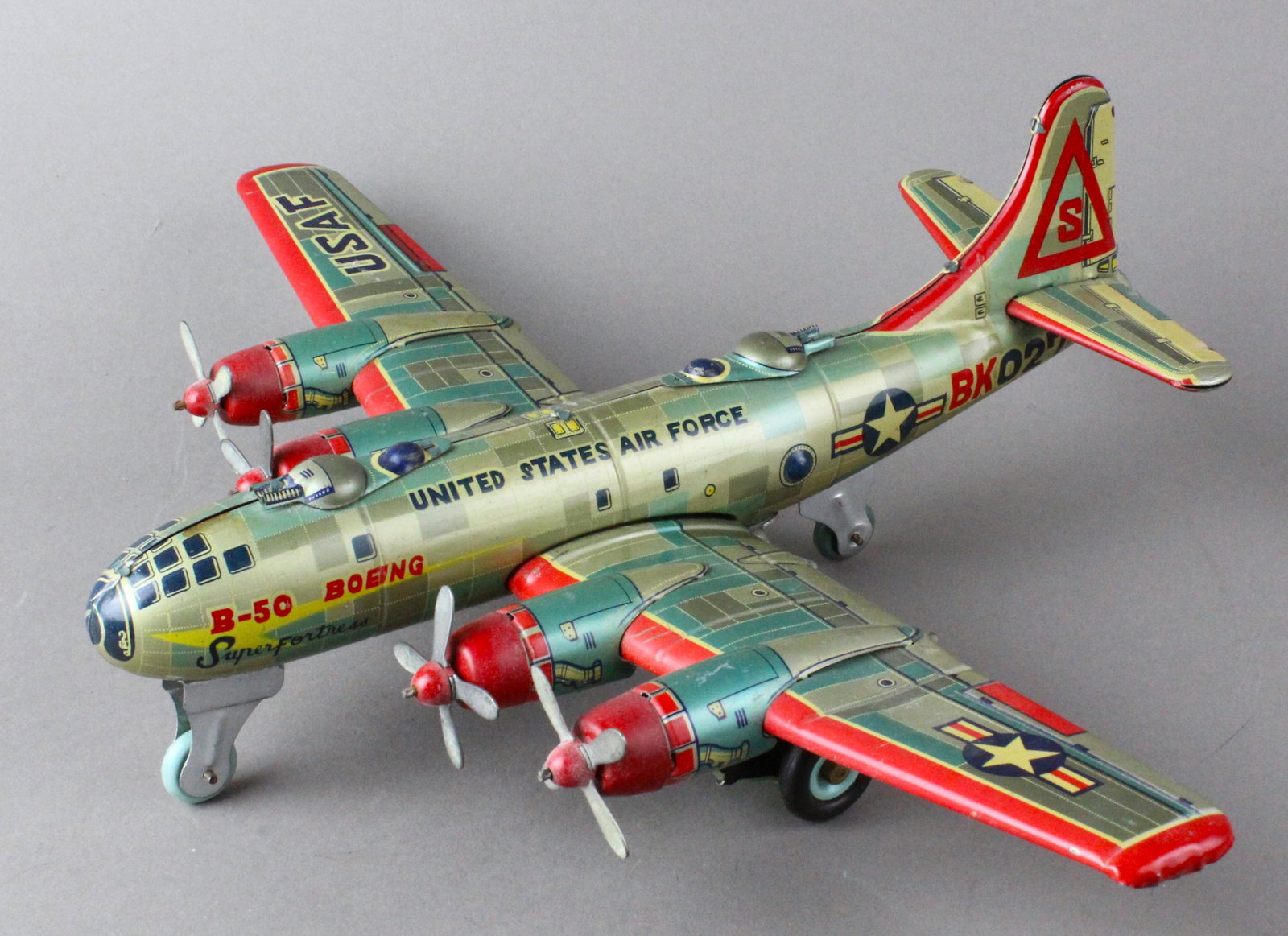 Japan Tin Boeing B-50 Super Fortress Air Force Plane: Cragstan Japan Tin Boeing B-50 Super Fortress Air Force Airplane. Friction operated 4 prop flying fortress. Friction runs all 4 propellers. Pictured in "Collecting Vintage Aircraft Toys" by Geoffrey R