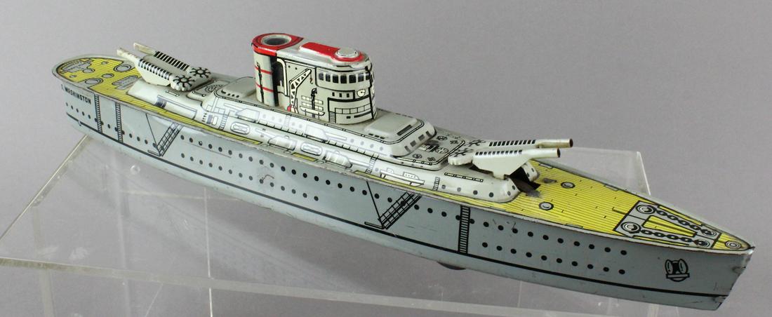 Marx USS Washington Battleship: Marx Tin USS Washington Battleship. Depth charge marked on deck, friction ship. 15 inches long.