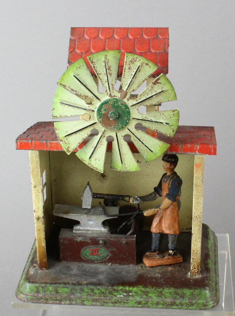 Doll Et Cie German Tin Blacksmith Toy: Doll Et Cie German Tin Blacksmith Toy. Steam or wheel crank smith shop.