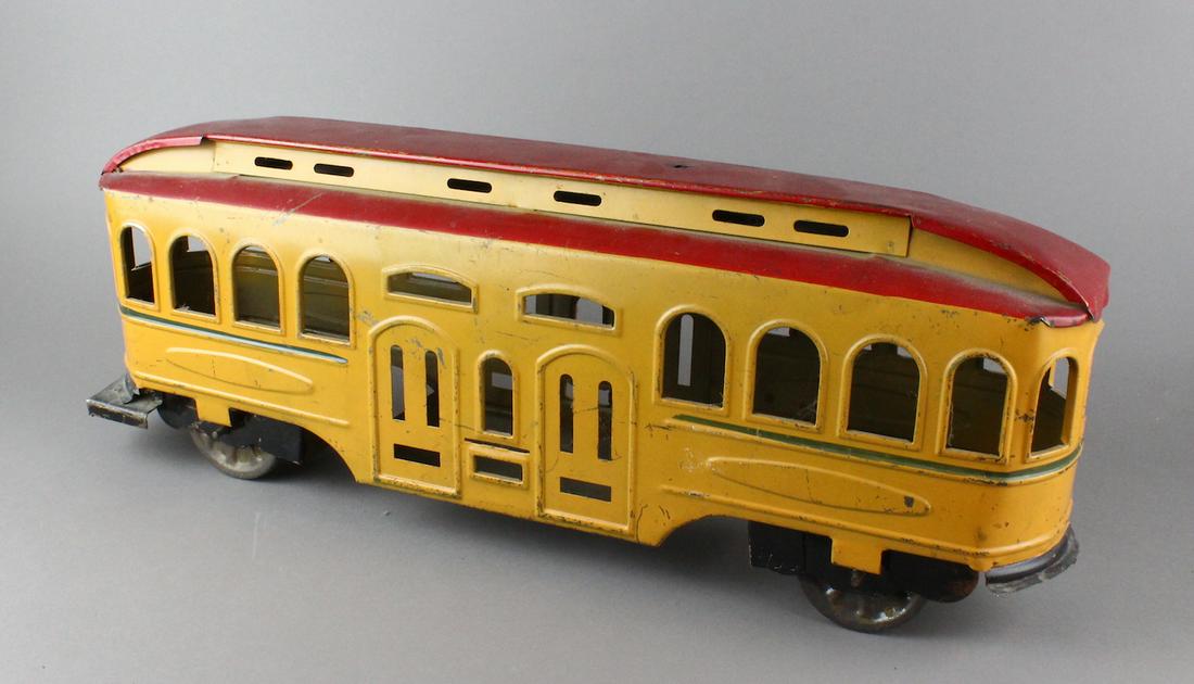 1900s Pressed Steel Trolley: Pressed Steel Trolley. Dayton or Scheible trolley in original paint, 21 inchese long. Missing top pole.
