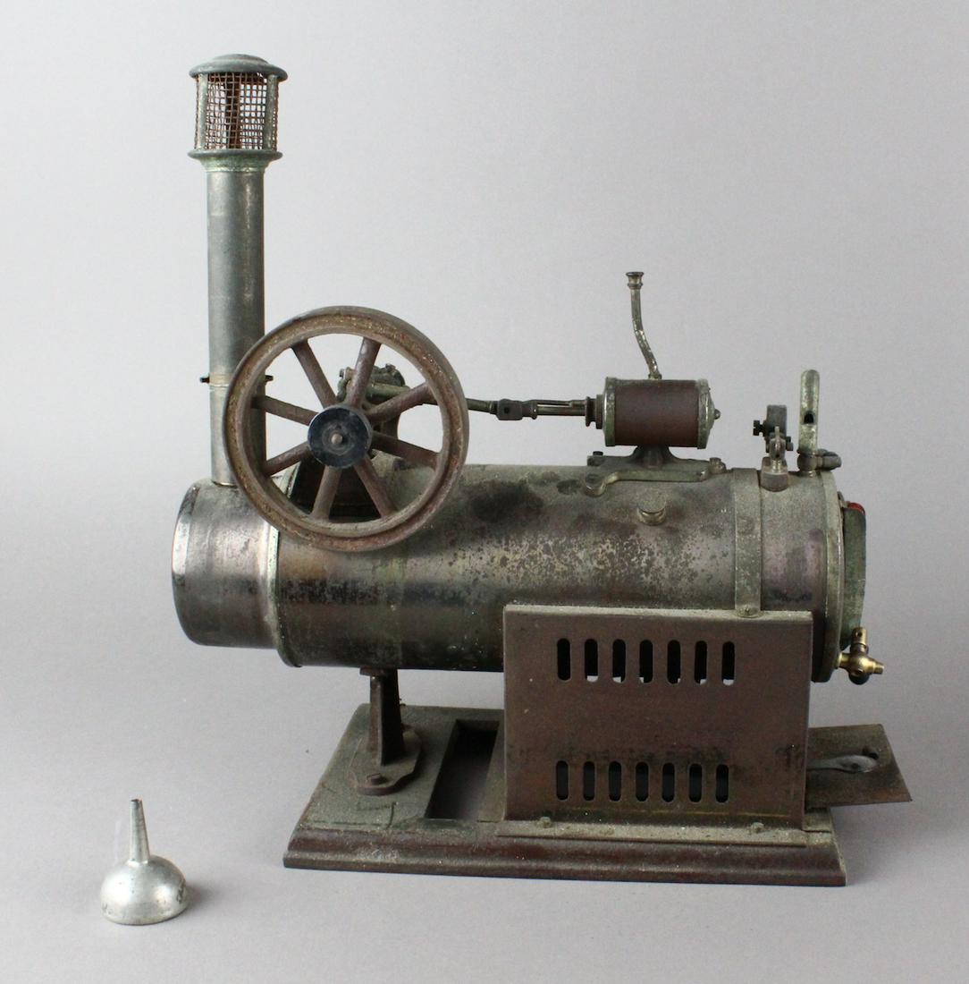 Schoener Steam Engine Horizontal Early German: Schoener German Horizontal Loco Steam Engine. Large original German steam engine c.1905. Heavy solid flywheel, whistle, burner and funnel. Base 8 x 5 x 12 height.