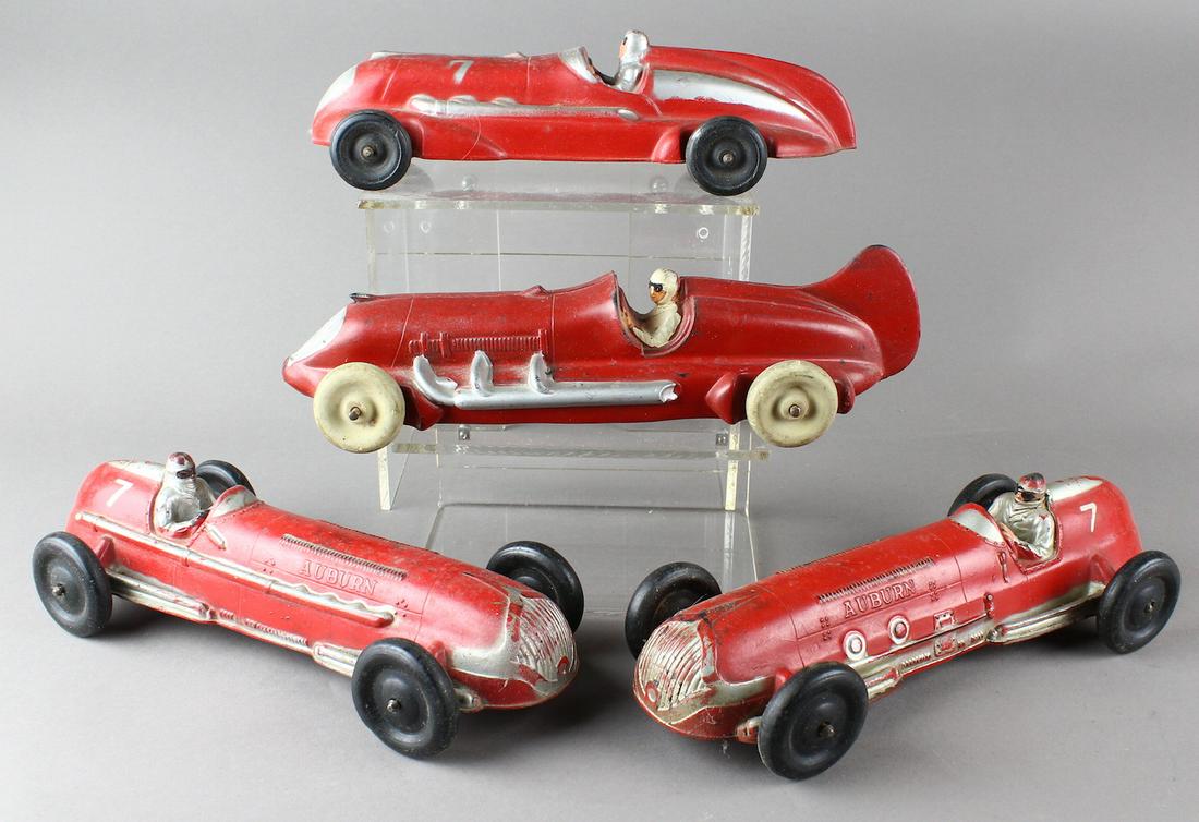 Auburn & Arcor Giant Race Cars Indy Style: Auburn & Arcor Giant Racers. Indy Style race cars with drivers measure 11 inches. These are scarce rubber racers.