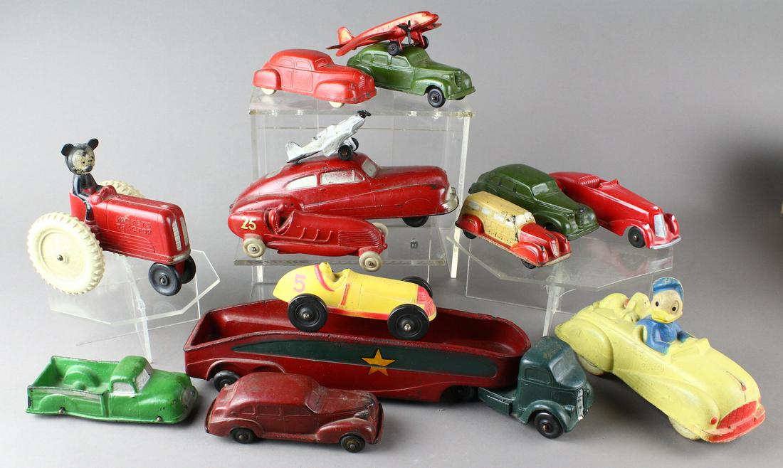 Mickey Mouse, Donald Duck & Rubber Cars & Trucks: Large group of Auburn & Sun Rubber Cars and Mickey Mouse and Donald Duck. Airplanes and trucks round out the large lot. (Red racer 25 is repaired).